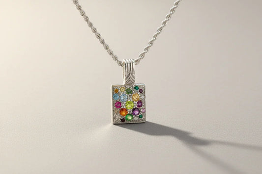 Silver rope chain necklace with a rectangular pendant featuring colorful gemstones