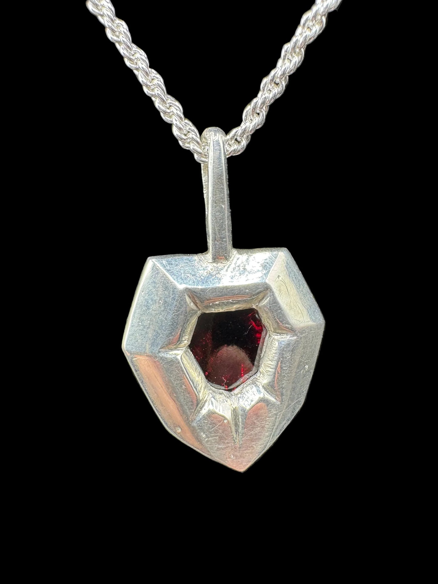 Handcrafted silver pendant necklace with geometric red gemstone, contemporary jewelry design