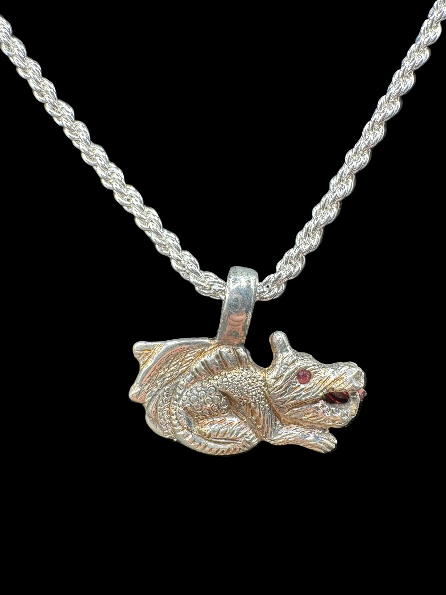 Handcrafted silver dragon pendant necklace with red gemstone eyes on braided chain