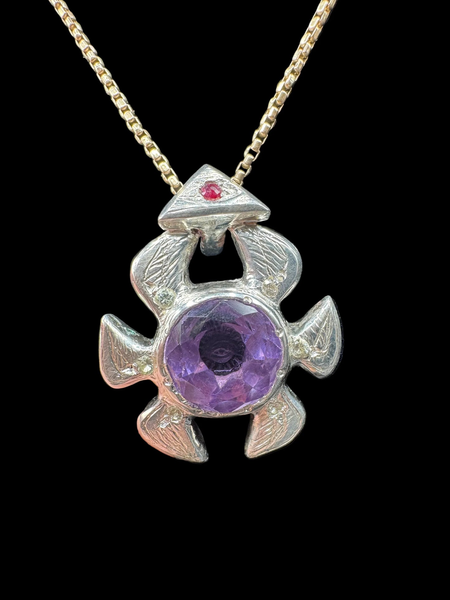 Handcrafted silver turtle pendant necklace with large amethyst gemstone and red accent stone