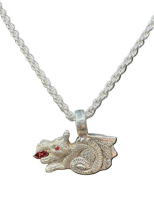 Handcrafted silver animal pendant with red gemstone eyes on a rope chain necklace