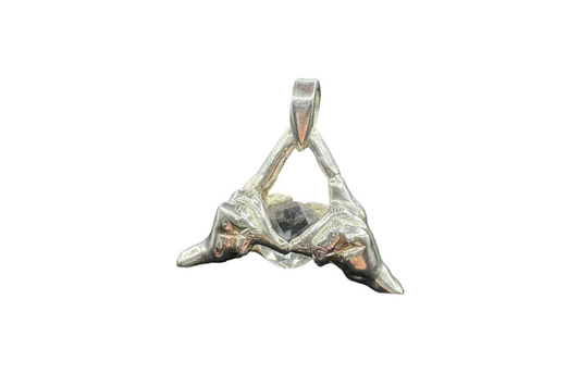 Handcrafted silver pendant with sculpted hands forming a triangle, featuring a clear gemstone