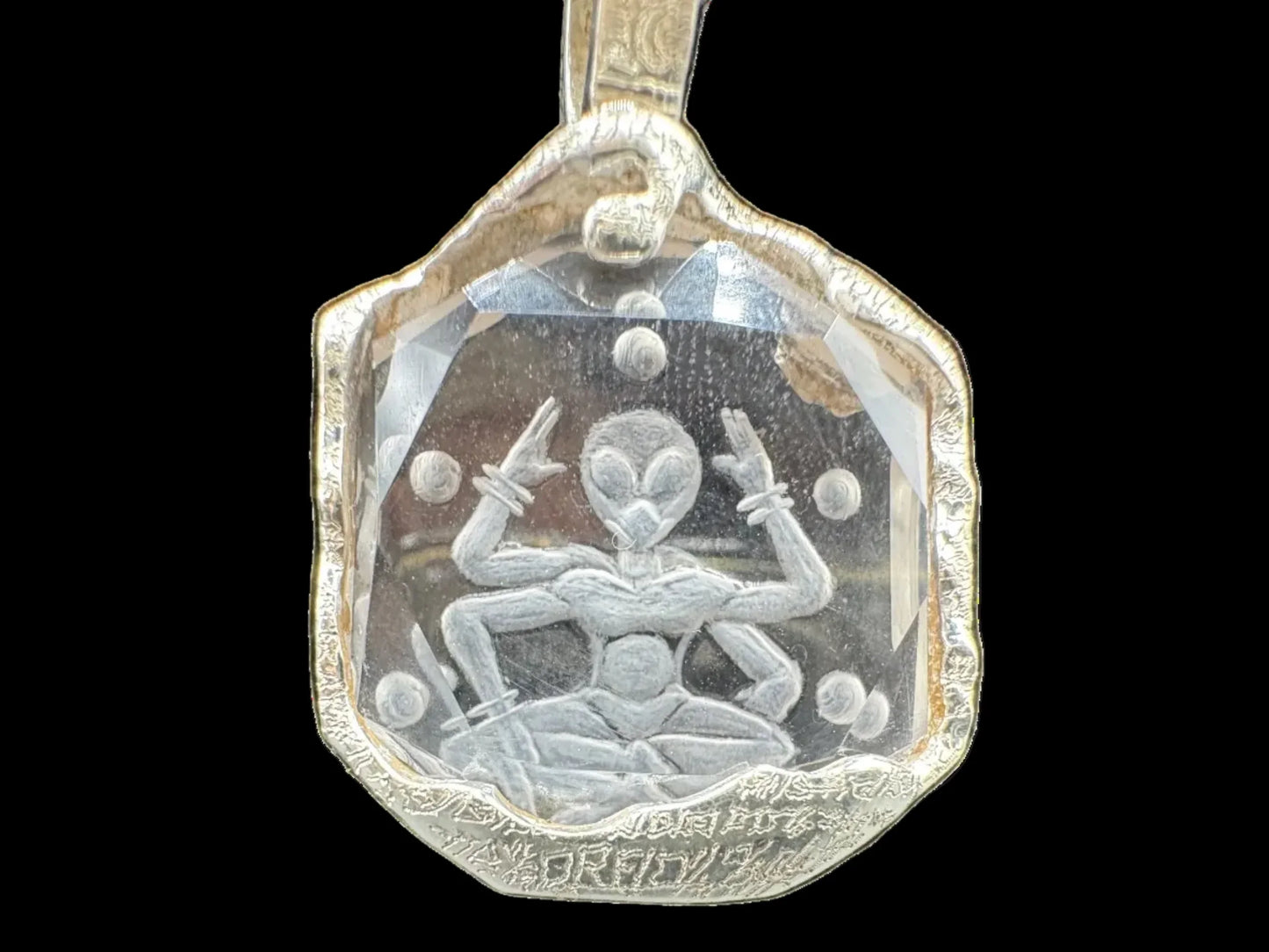 Handcrafted crystal pendant featuring an alien figure with multiple arms and engraved silver frame