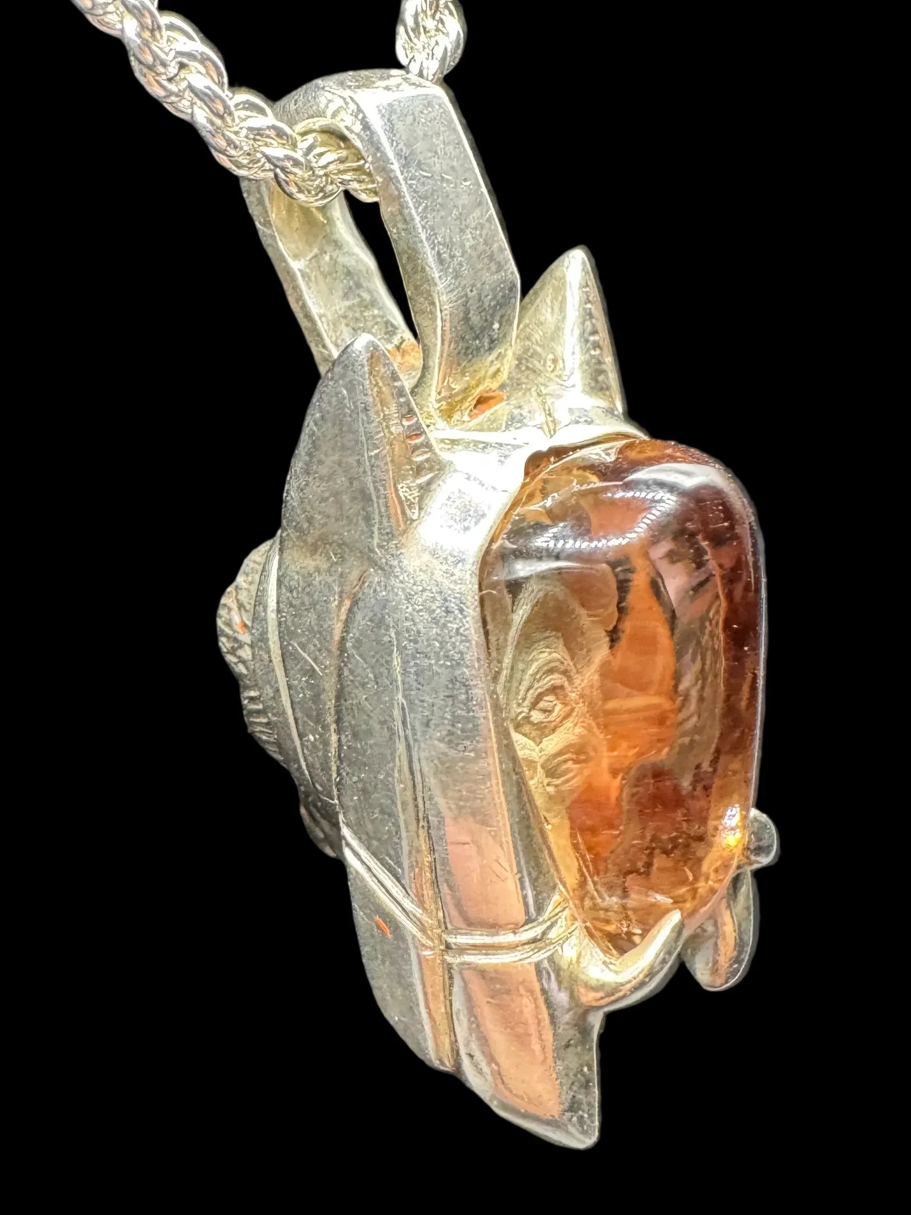 Handcrafted silver pendant with orange gemstone on rope chain, unique artistic jewelry