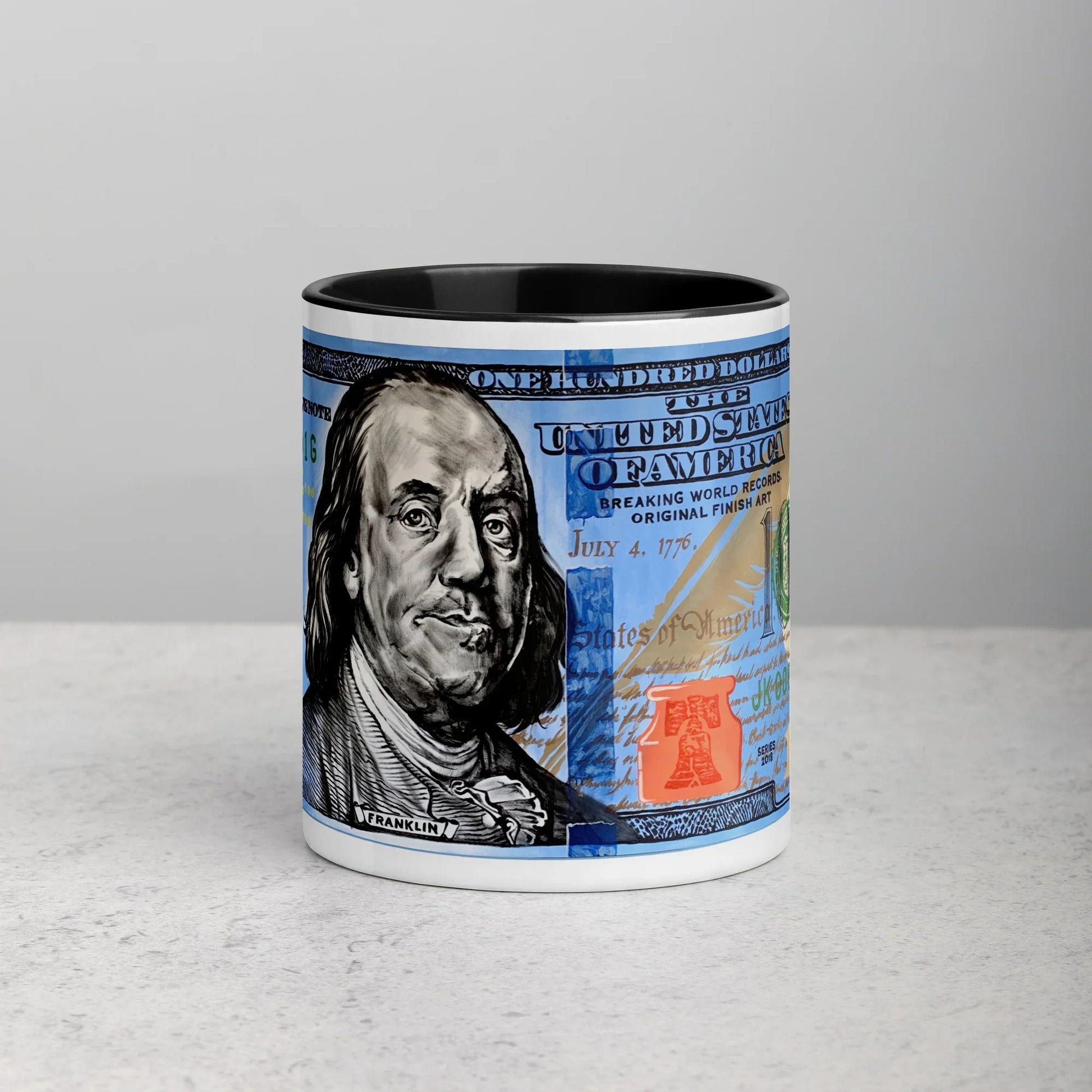 White ceramic mug with black interior featuring a $100 bill design illustration