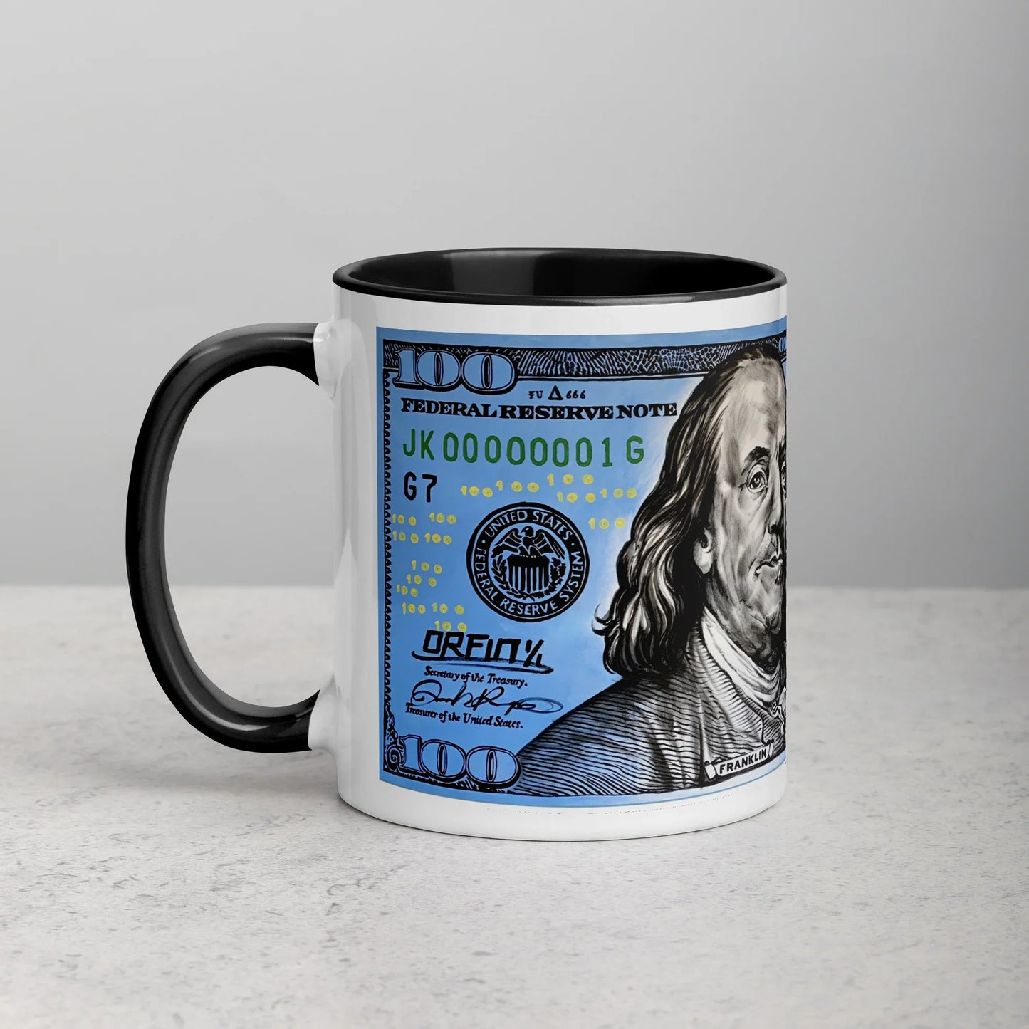 White ceramic mug with black handle and interior, featuring $100 bill graphic design.